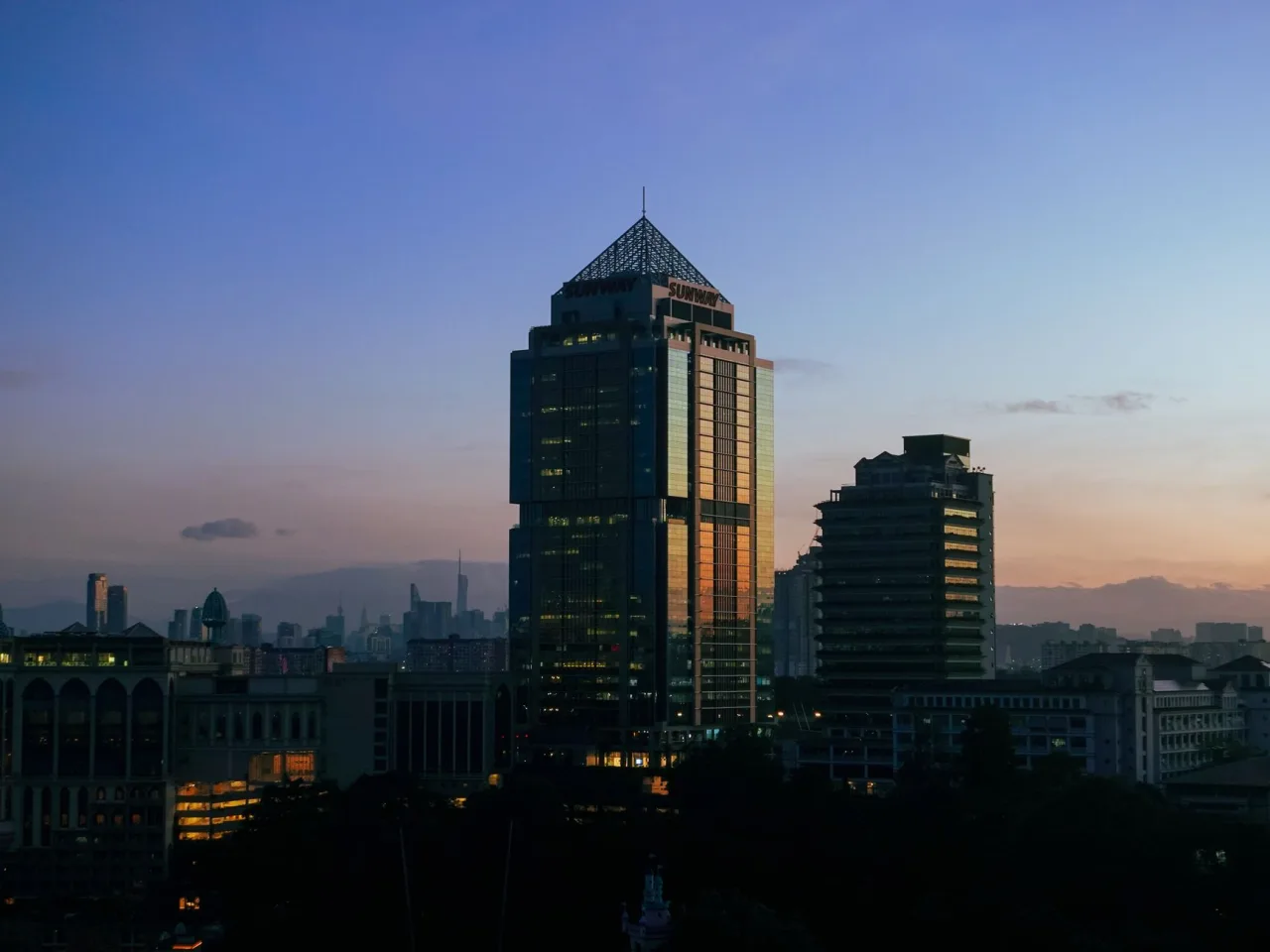 Menara Sunway and the surrounding Bandar Sunway skyline at dusk.