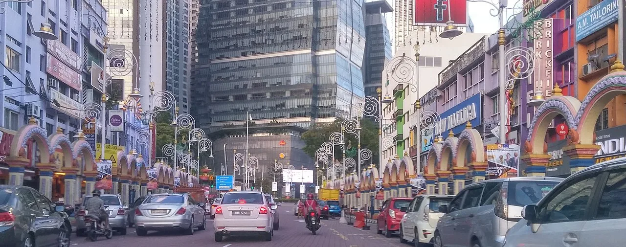Traffic and shopfronts along Brickfields' Little India corridor.