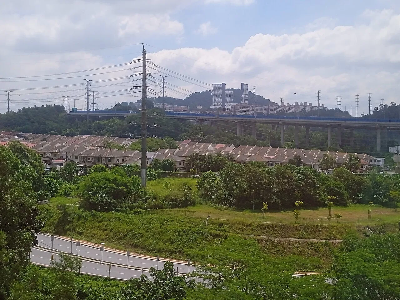 Aerial view across Taman Cheras Hartamas and its transport corridor.