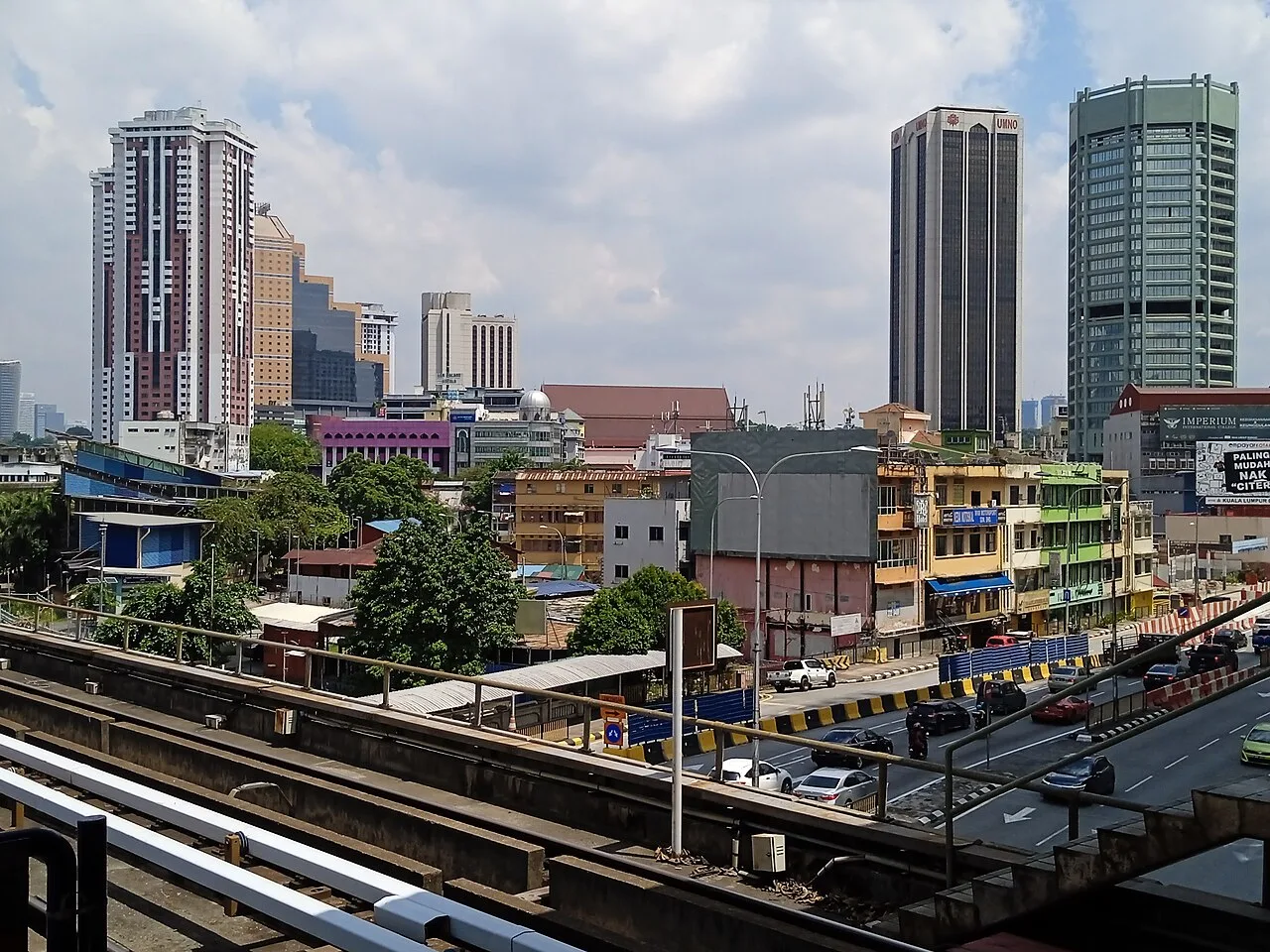 Chow Kit's rail corridor, shophouses and central skyline.